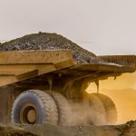 Strengthening GHG Management in Gold Mining Operations 4 Mining haul truck loaded with rock at sunset
