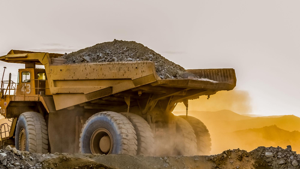 Strengthening GHG Management in Gold Mining Operations 1 Mining haul truck loaded with rock at sunset